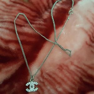 AUTHENTIC NWOT Chanel logo necklace.