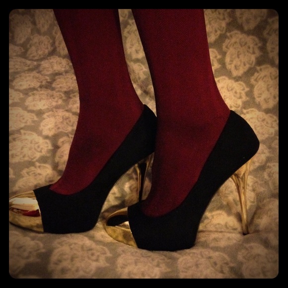 Black stilettos with gold tips