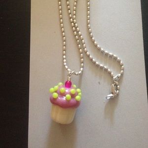 Pink cupcake glass charm.