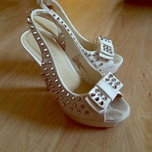 White spike heels