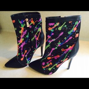 Rocking splattered paint boots