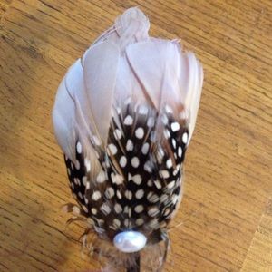 Feather accented headband.