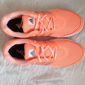 Brand new orange Adidas shoes