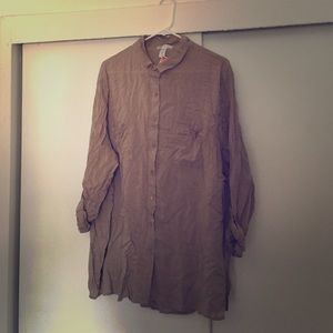 Long sleeve tan blouse.