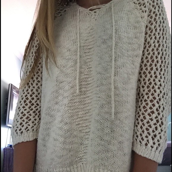 knitted sweater with crochet detailing on sleeves