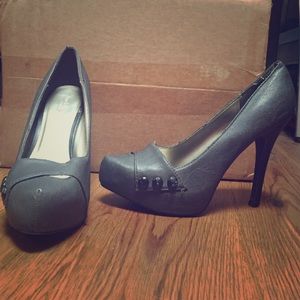 Grey pumps with button design