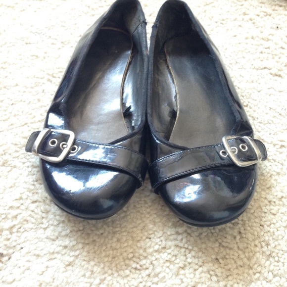 Black buckle flats