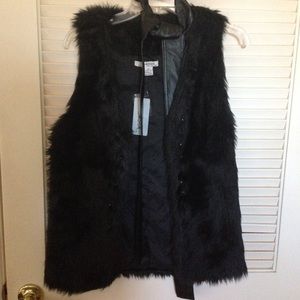 Black fur vest with leather tie