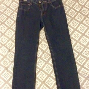 Dark denim straight legged skinny jeans.