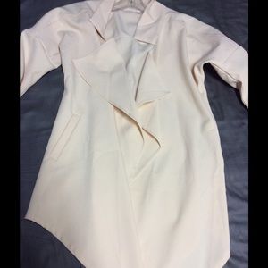 Blush pink colored drapey cardigan.