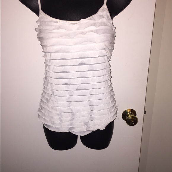 White sleeveless top.