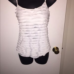 White sleeveless top.