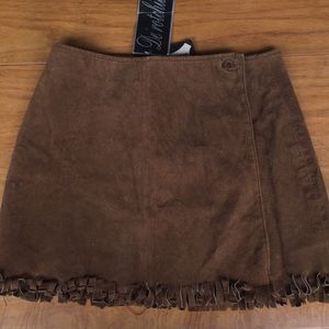*Fully lined suede miniskirt with fringe bottom