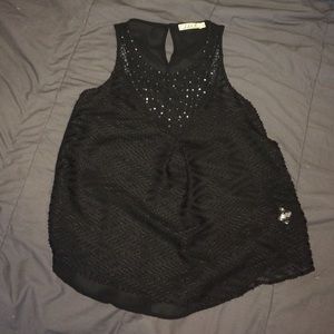 A black loose fitting tank top