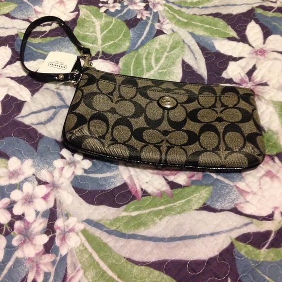 Coach NWT clutch. With wristlet. New w tag