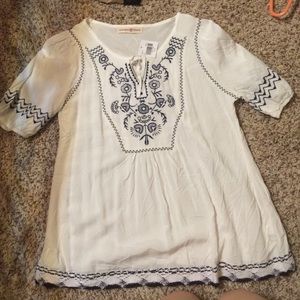 Small altar'd state shirt-tags still on