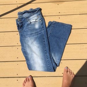 Faded jeans and pink sweat pants