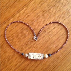 Copper colored bead and carved bone style necklace