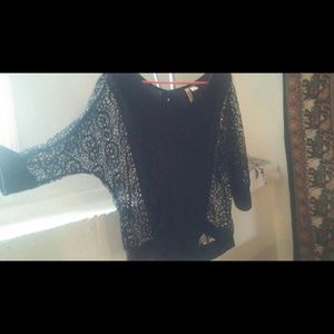 Black mesh sleeved top, button down back