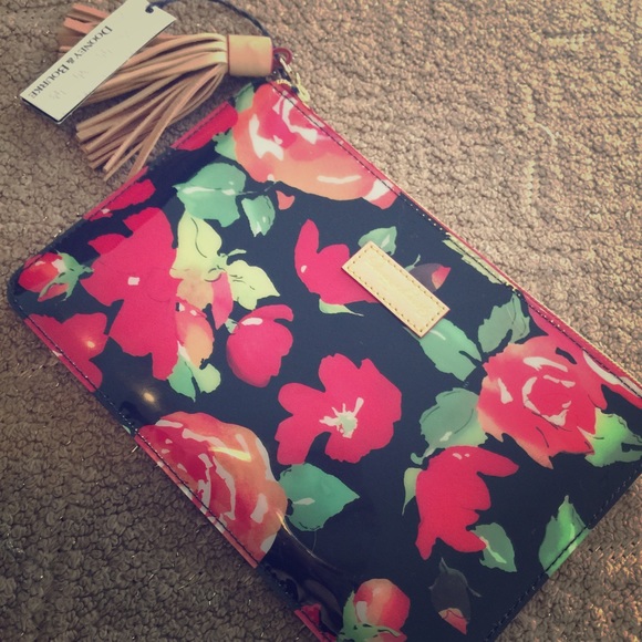 Glossy floral Dooney & Bourke clutch with tassel!