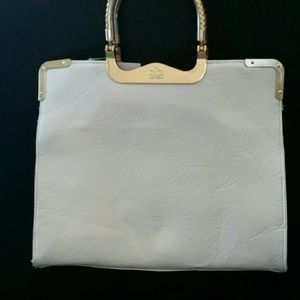 Matte white handbag with gold trim