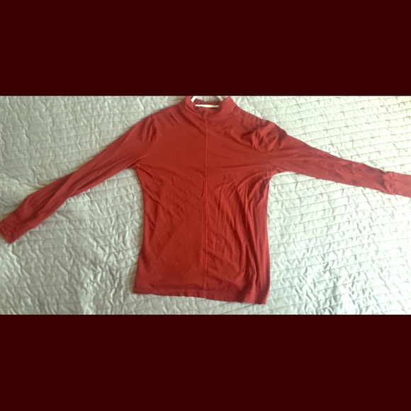 Red long sleeved high neck shirt