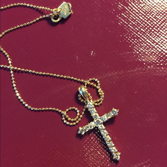 Diamond gold cross necklace.