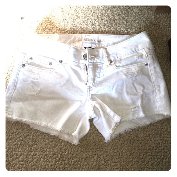 White ripped jean shorts