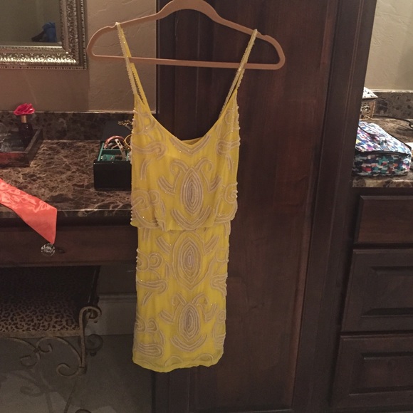 Size med. Yellow and beaded cocktail dress