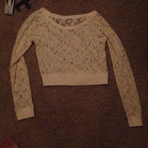 Cream colored Express top with floral lace design