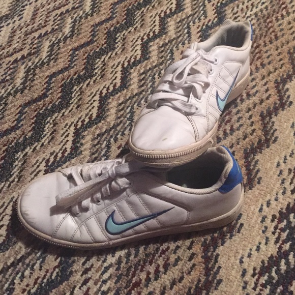 Nike sneakers with blue swoosh
