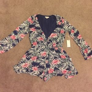 Floral romper, never worn, still has tags