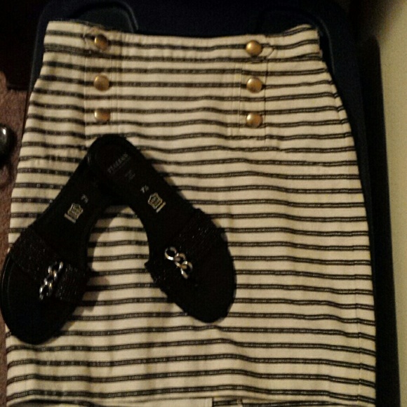 A cute sailor skirt with black sandals as a bundle