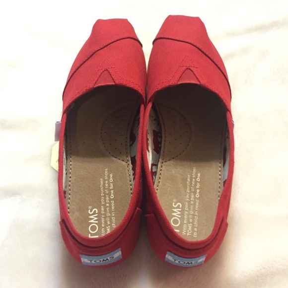 Pair of red canvas TOMS size 7.5