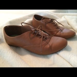 Brown lace-up flats