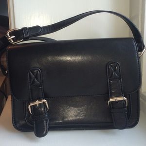 Black handbag with gold buckles