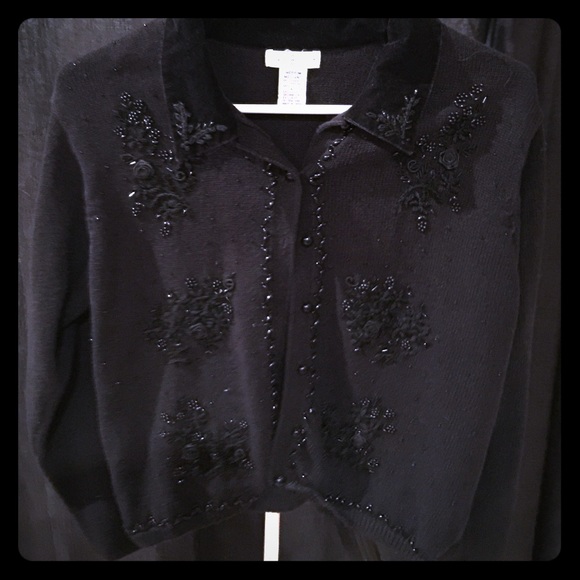 Black dress sweater with beaded detail work.