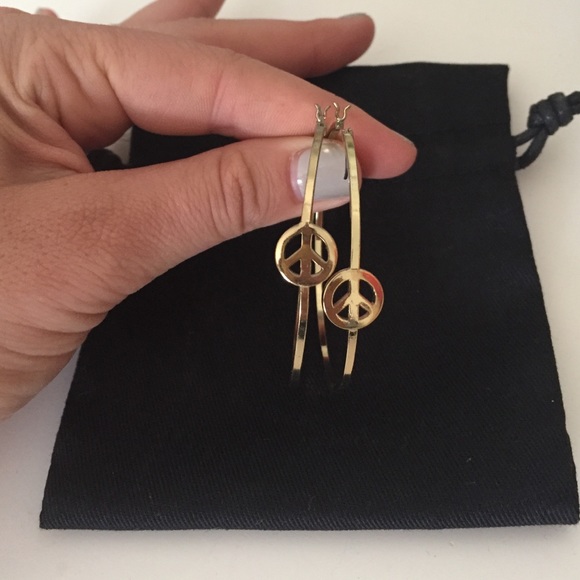 Large peace sign hoop earrings in gold!