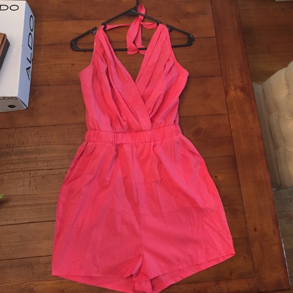 Pink romper with tags