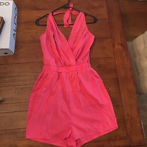 Pink romper with tags