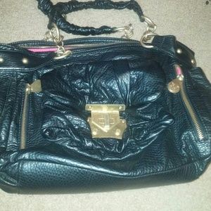 big black purse with pink interior