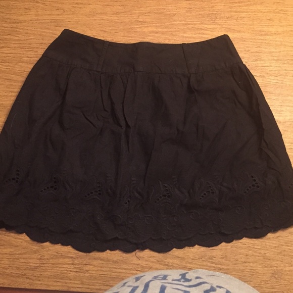 Black embroidered skirt.