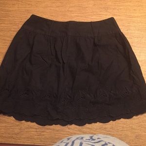 Black embroidered skirt.