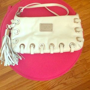 White Michael Kors wristlet/clutch with tassels.