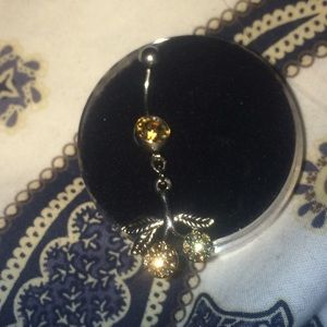 Belly button piercing: dangly auburn cherry