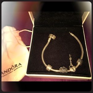Pandora bracelet, two clips, and two charms
