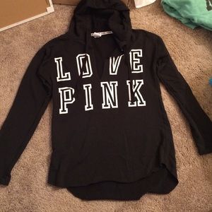 Black, loose-fitting VS hoodie.