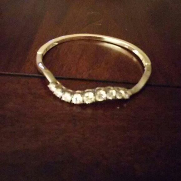 Costume diamonds, silver colored bracelet :)