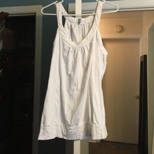 white long sleeveless top