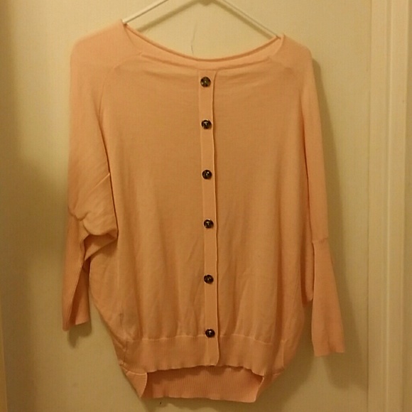 Pink shirt with jewels and patches on back